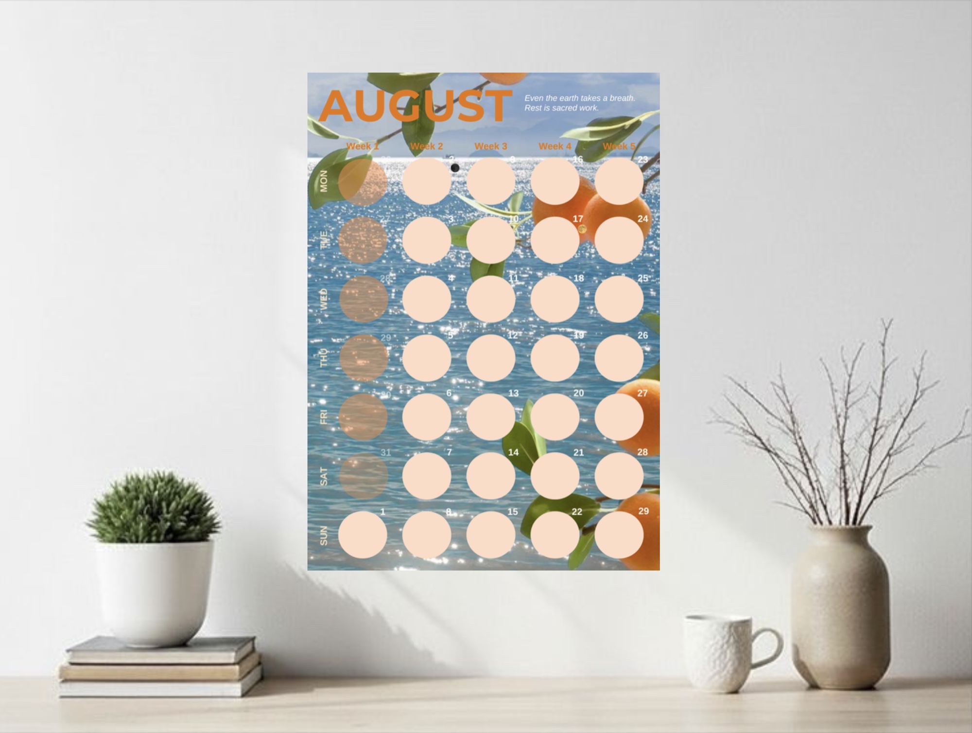 The August page of the 2027 calendar, framed and hung on a wall