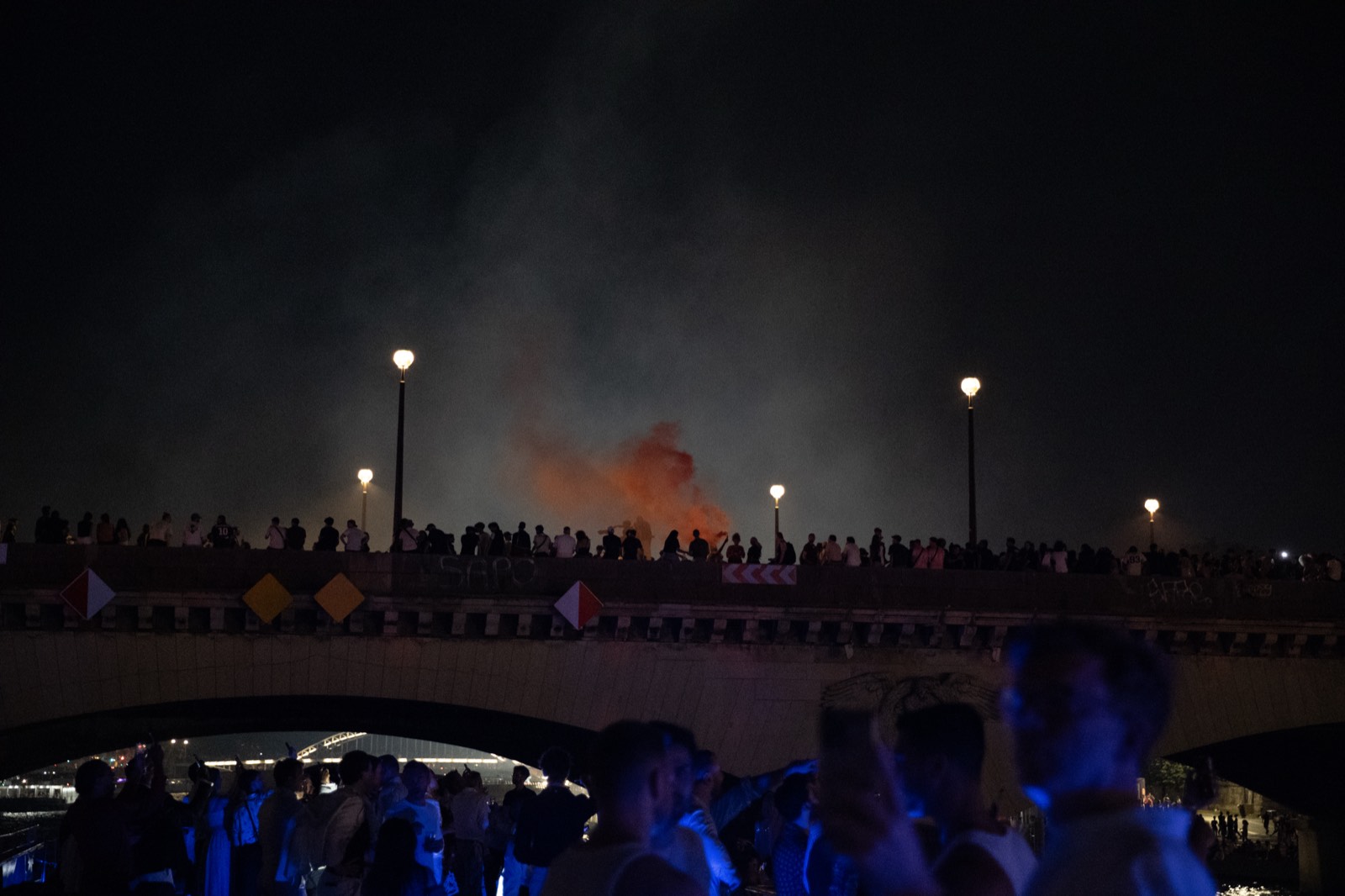 Colourful smoke rising over Pont Alexandre III during the fireworks display